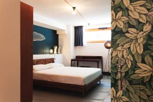 A bed or beds in a room at Case Madira