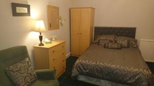 Postel nebo postele na pokoji v ubytování Crawfords Guest house