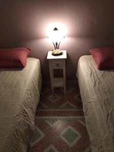Кровать или кровати в номере VILA INSPIRATION - ON KINI BEACH