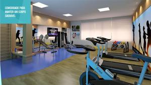 a gym with exercise equipment and a treadmill at Vog Torres do Sul in Ilhéus