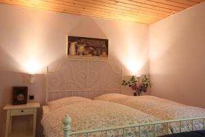 Postel nebo postele na pokoji v ubytování Hotel Weingewolbe