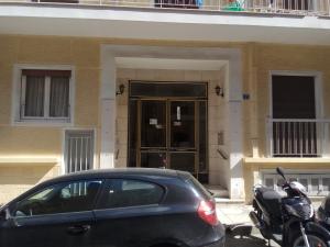 a car parked in front of a building at TONI'S 2BD Modern flat in Koukaki near Acropoli in Athens