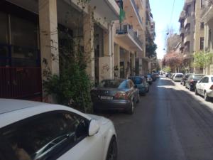 a row of cars parked on a city street at TONI'S Cute Home for Couples, Archeological Museum in Athens