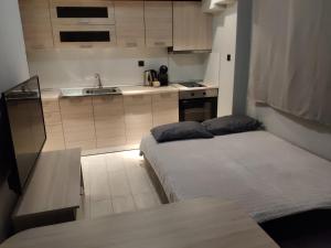 a small kitchen with two beds in a room at Standard Apartment by Prima Lodging in Thessaloniki +13 photos