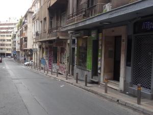 an empty city street with a row of buildings at TONI'S 4BD near Classy KOLONAKI, locals enjoy it in Athens
