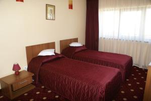 Postel nebo postele na pokoji v ubytování Hotel Ferdinand + 22 fotografií