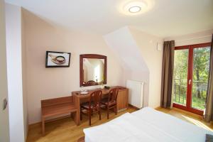 Postel nebo postele na pokoji v ubytování Hotel Delalut