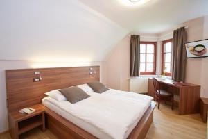 Postel nebo postele na pokoji v ubytování Hotel Delalut