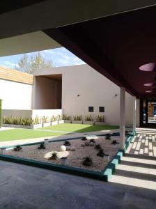 an external view of a house with a garden at garden33 in Chivilcoy
