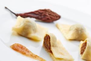 a group of food items on a white plate at Hotel Delalut in Ravne na Koroškem