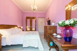 Postel nebo postele na pokoji v ubytování A Roman Tale B&B