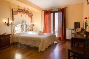 Posteľ alebo postele v izbe v ubytovaní Borgo Medievale