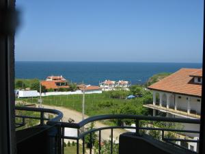 a view of the ocean from a balcony at Family Hotel ATLAS in Sinemorets