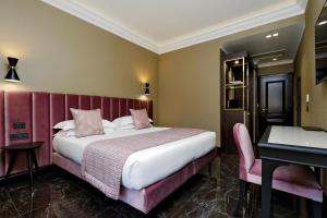Krevet ili kreveti u jedinici u objektu BQ House Colosseo Luxury Rooms