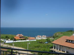 a view of the ocean from a house at Family Hotel ATLAS in Sinemorets