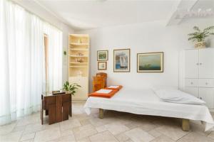 Posteľ alebo postele v izbe v ubytovaní Apartments Varos