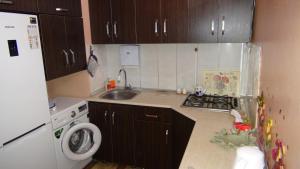 a small kitchen with a sink and a refrigerator at Nizami Fountains 2024 in Baku +6 photos