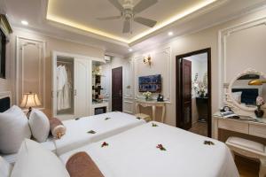Voodi või voodid majutusasutuse Royal Holiday Hanoi Hotel toas