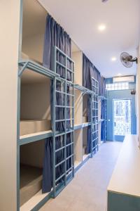 a walk in closet with blue shelving at The Big Easy Phnom Penh in Phnom Penh