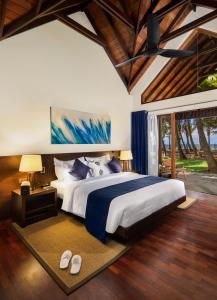 A bed or beds in a room at Ayana Sea