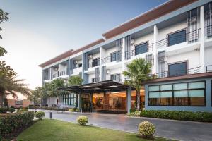 an exterior view of a hotel at Ray Hotel Buriram in Buriram