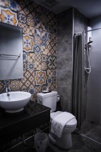 a bathroom with a toilet and a sink at Na BaanYa Chiang Mai in Chiang Mai