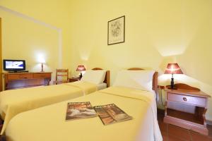 Postel nebo postele na pokoji v ubytování Hotel Maisonnette