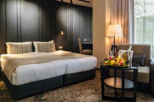 Ένα ή περισσότερα κρεβάτια σε δωμάτιο στο Spa Hotel Calista