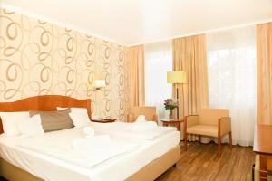 Giường trong phòng chung tại Apart Hotel Haveltreff