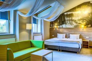 Łóżko lub łóżka w pokoju w obiekcie Hotel Loft 1898