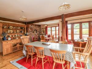 a dining room with a table and chairs at Derrywater House in Aughrim