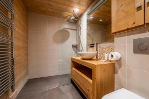 a bathroom with a toilet and a sink at Abachi Chalet Les Gets - by EMERALD STAY in Les Gets +34 photos