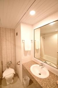 Baðherbergi á Wangcome Hotel