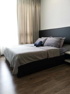 Giường trong phòng chung tại Landmark Residence Sungai Long High Speed Internet near TAR College MRT