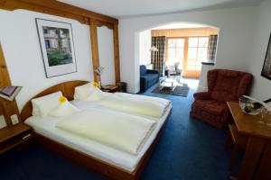 Postel nebo postele na pokoji v ubytování Hotel Alpin