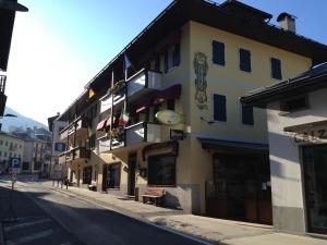 a building on the side of a street at Albergo Garni Barancio in Auronzo di Cadore