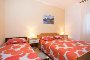Postel nebo postele na pokoji v ubytování Apartments Kraljic