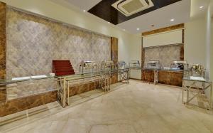 A kitchen or kitchenette at The Fern Residency, Jaipur