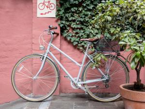 
a bicycle parked in front of a brick wall at Boutiquehotel Stadthalle in Vienna

