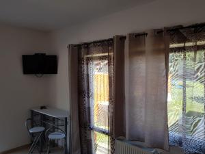 Telewizja i/lub zestaw kina domowego w obiekcie Sofias Apartment