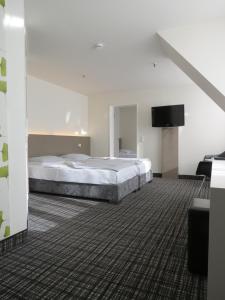 Postel nebo postele na pokoji v ubytování Comfor Hotel Ulm City