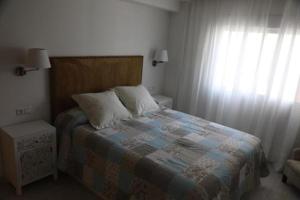 Posteľ alebo postele v izbe v ubytovaní Apartamento Montes de Oca