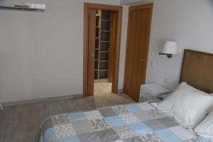 Posteľ alebo postele v izbe v ubytovaní Apartamento Montes de Oca