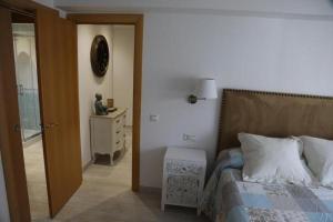 Posteľ alebo postele v izbe v ubytovaní Apartamento Montes de Oca