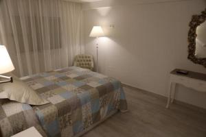 Posteľ alebo postele v izbe v ubytovaní Apartamento Montes de Oca