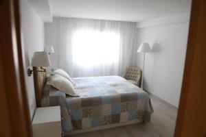 Posteľ alebo postele v izbe v ubytovaní Apartamento Montes de Oca