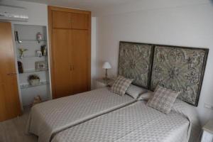 Posteľ alebo postele v izbe v ubytovaní Apartamento Montes de Oca