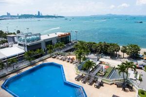 an aerial view of a resort with a swimming pool at Markland Seaside Pattaya in Pattaya Central