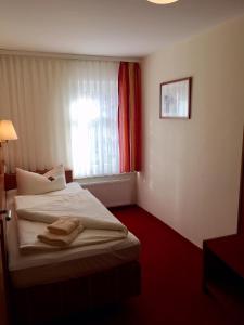 Cama ou camas em um quarto em Landgasthof Zur Tanne