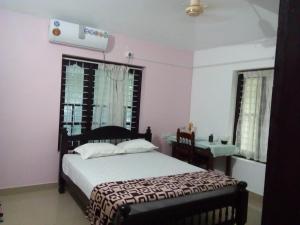 a bedroom with a bed and a desk in it at ETERNAL ISLE INN in Munroe Island